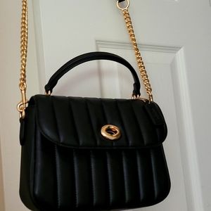 Coach cross body.  Nappa black leather  linear quilted.   Brand new with tags.